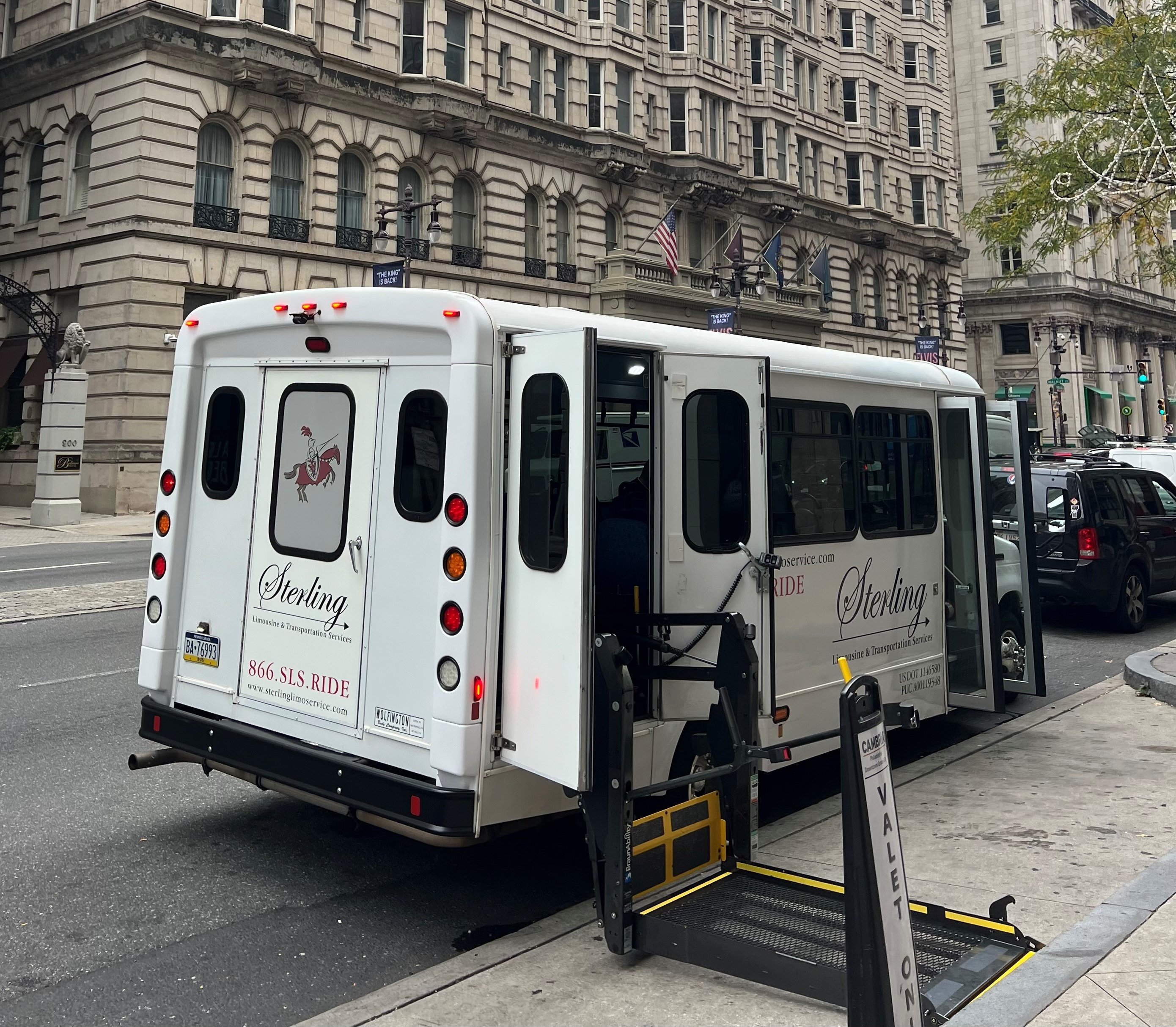 Rear view of ADA mini bus with extended wheelchair ramp
