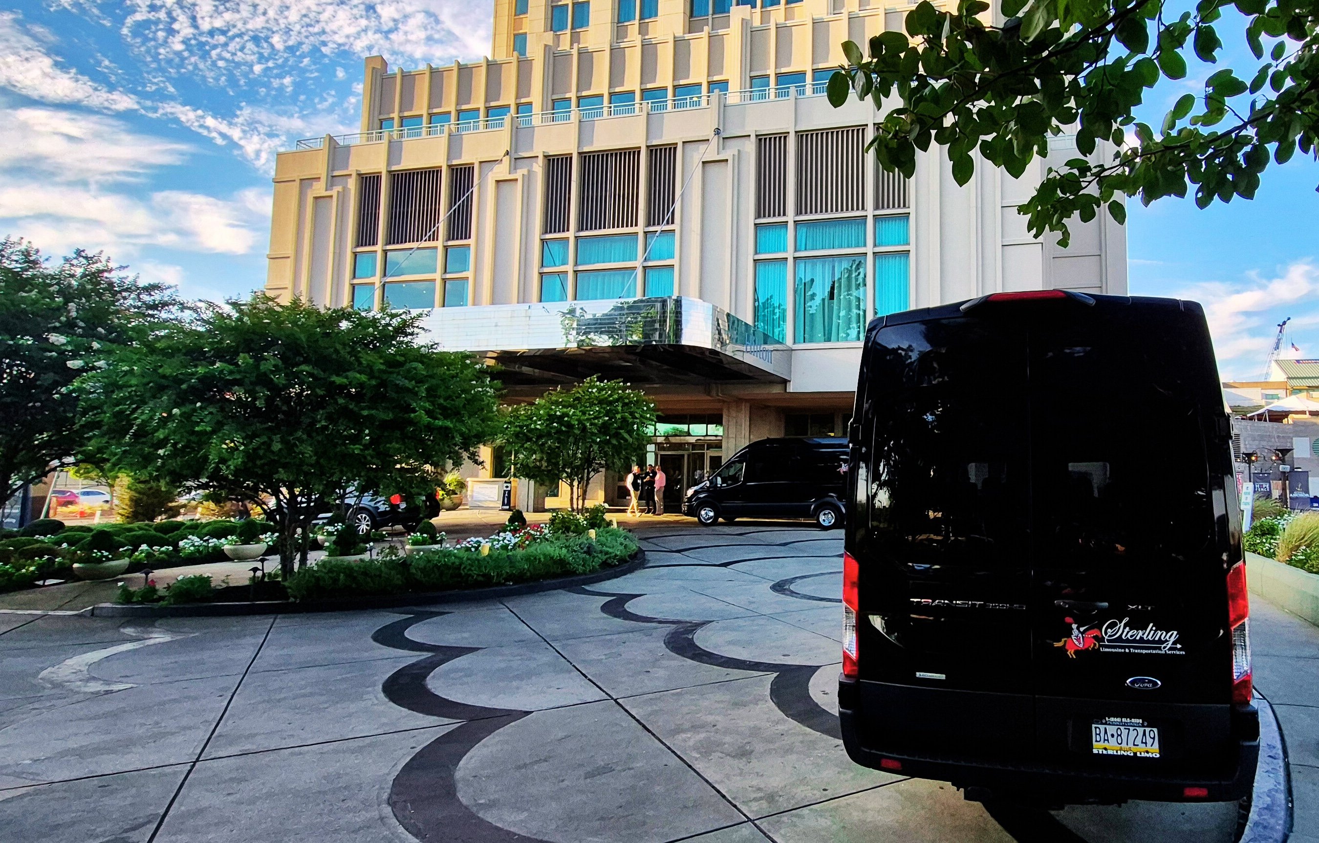 Transit van rear tail lights at hotel on water