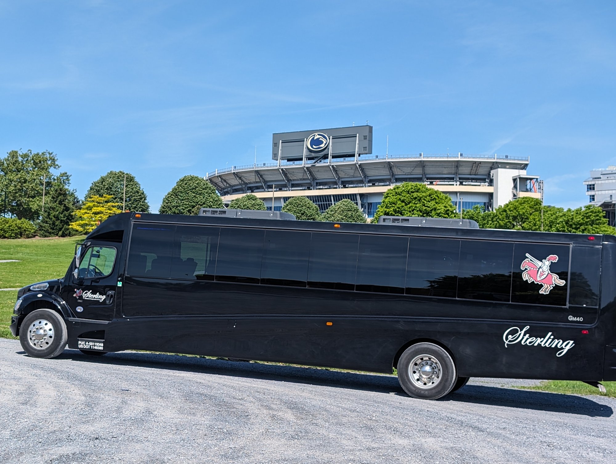 Black Mini Bus - Penn State - during the day