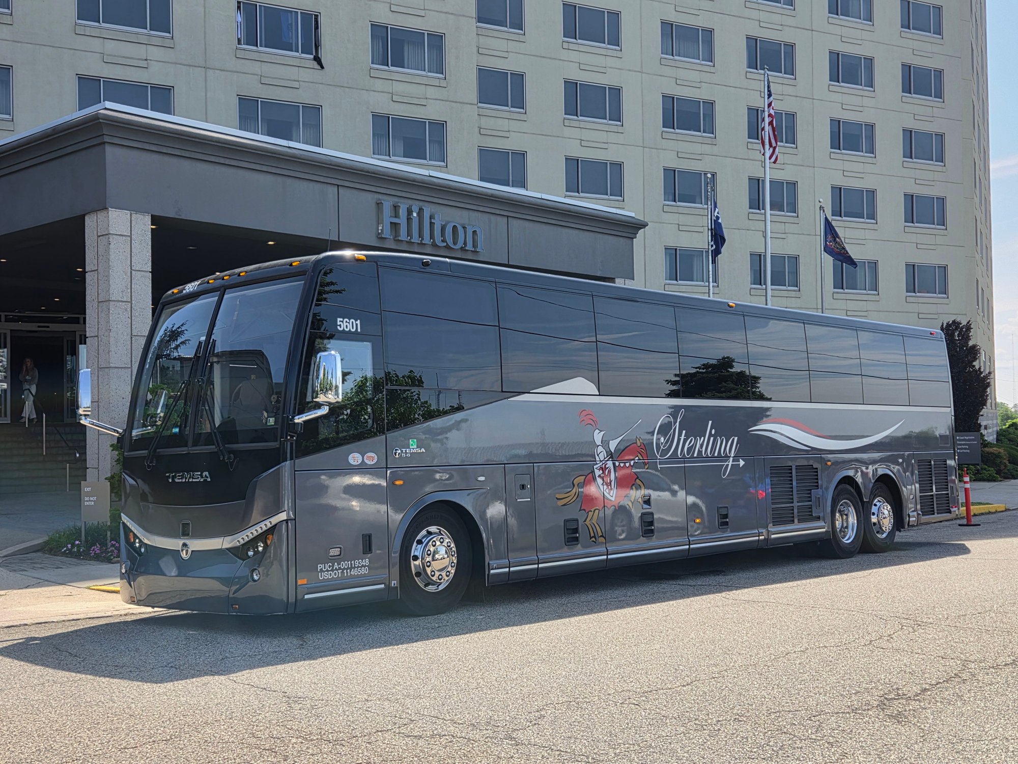 Motor coach in front of a hotel
