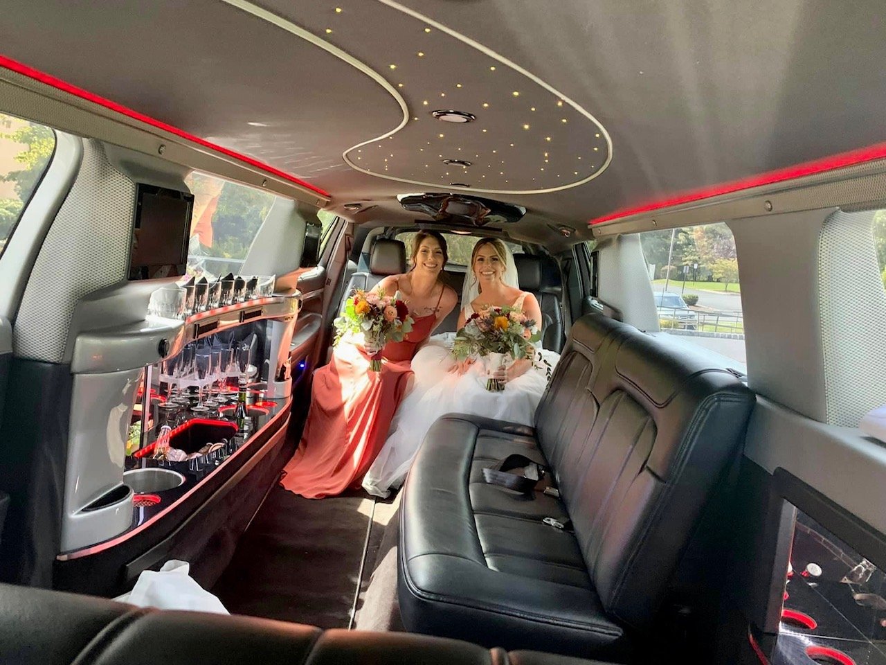 Wedding (bride and maid of honor) party in limo 1