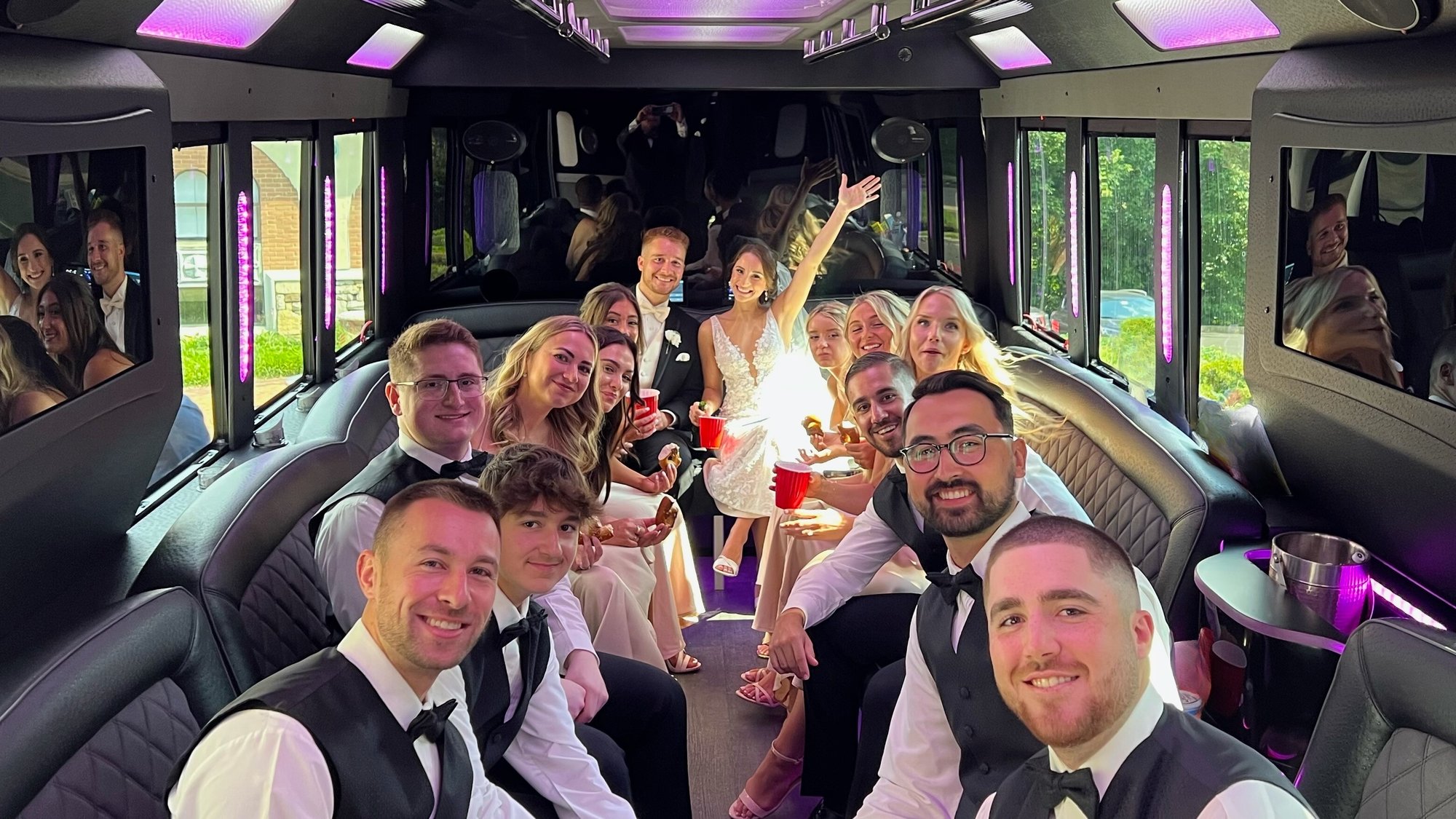 Wedding party in limo bus 1