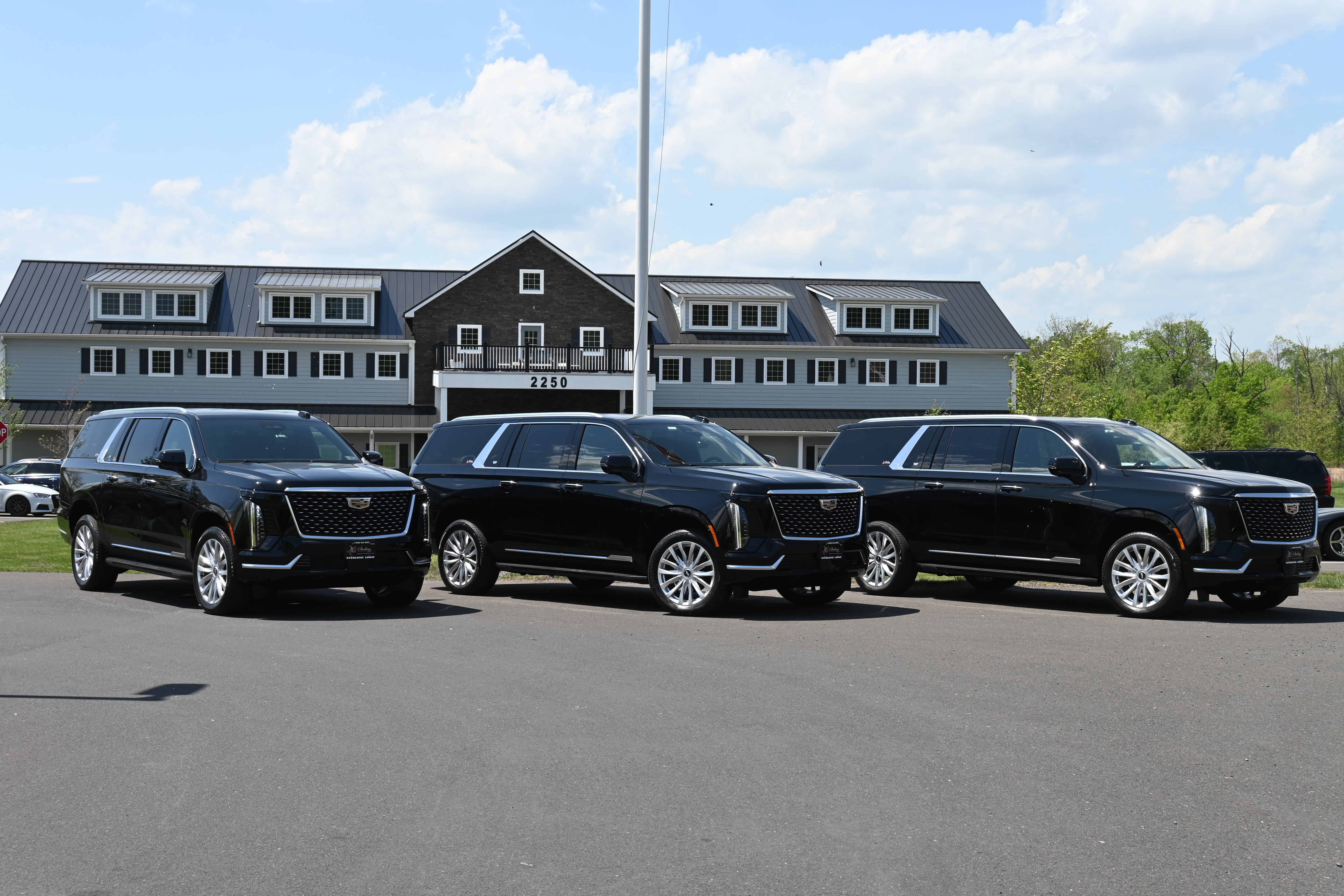 Row of Escalades at Sterling Headquarter